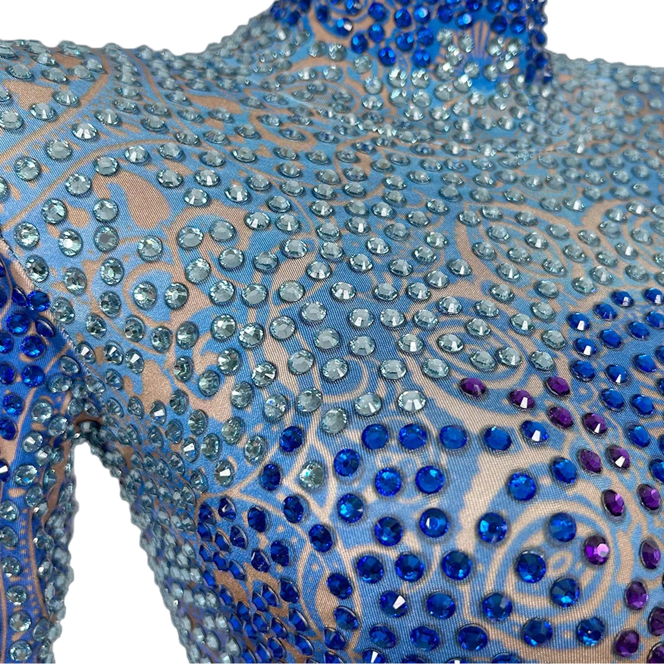 Close-up of a Skye Blue Rhinestone Bodysuit, featuring hand-glued blue and purple rhinestones and sewn sequins on spandex.