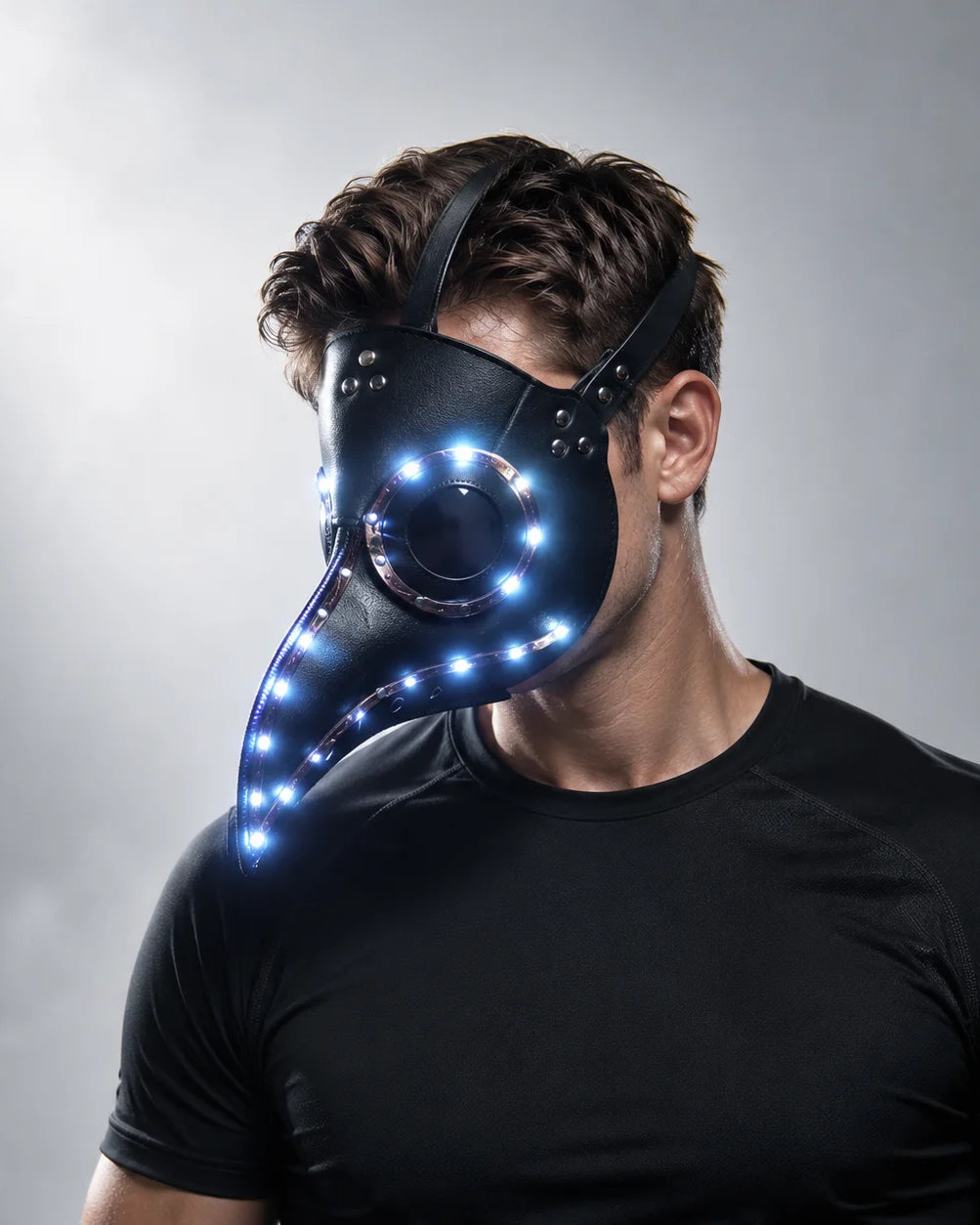 Black faux-leather steampunk plague doctor mask featuring glowing LED lights and an adjustable strap for a comfortable fit.