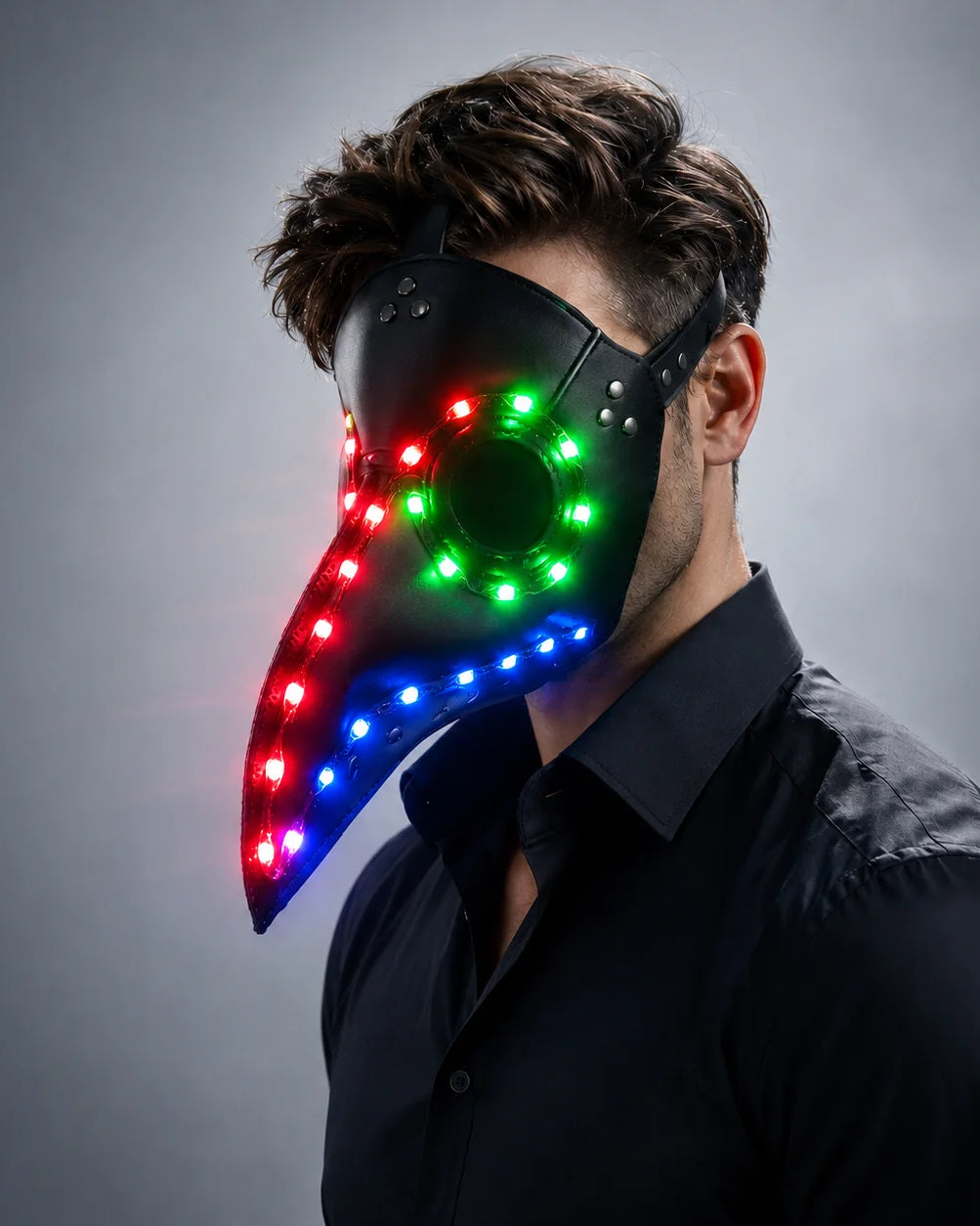 Black faux-leather steampunk plague doctor mask featuring vibrant, multi-colored LED lights and an adjustable strap.