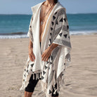Men's Tulum Fringe Cardigan in white polyester with black geometric patterns and long fringe hem.