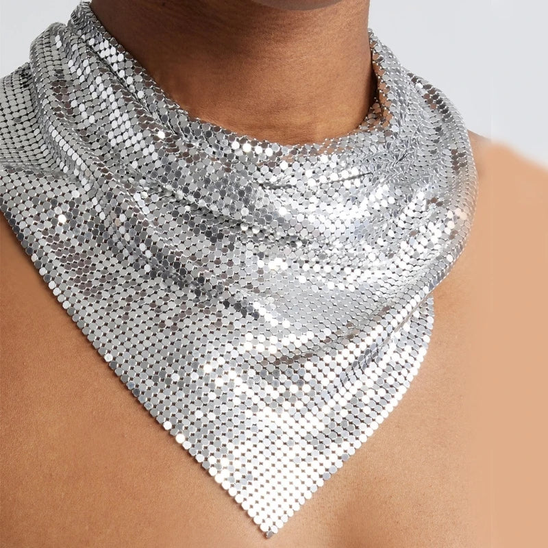 Silver liquid metal mesh scarf, triangular bib style, draped on a neck and chest.