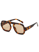 Tortoiseshell square sunglasses with a bold polycarbonate frame and light brown UV-400 resin lenses.