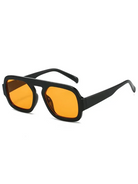 Unisex Brussels retro square sunglasses featuring a black polycarbonate frame and vibrant orange resin lenses.