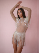 Nude Alma Rhinestone Fringe Festival Bodysuit with sparkling rhinestones, sequins, and flowing tassels.