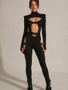 Black Cyber Gothic Bodysuit with cut-outs, metallic buckles, and long sleeves.