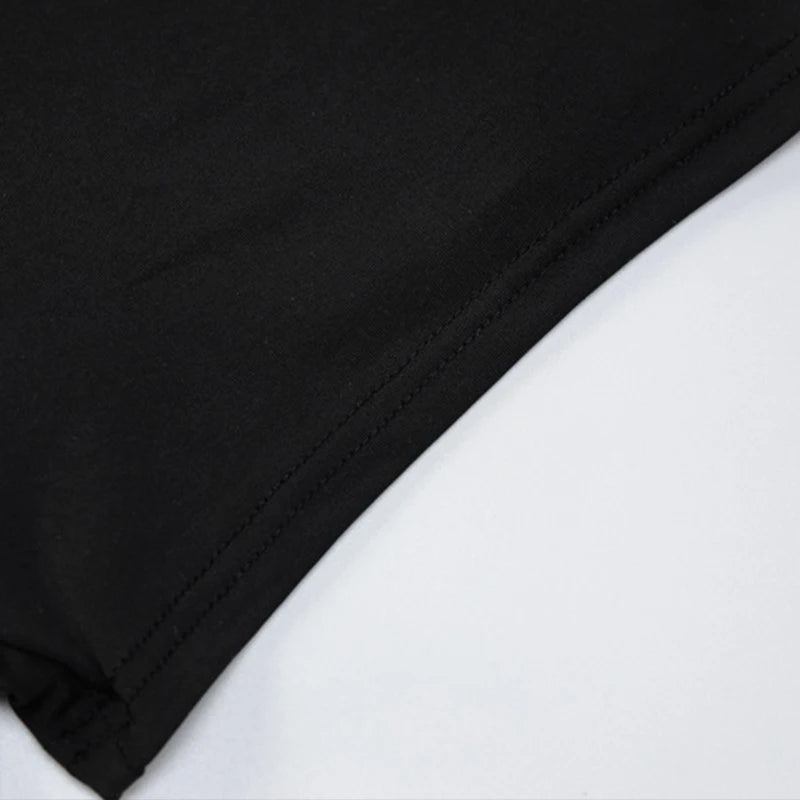 Black Hollow-Out Body fabric close-up showcasing smooth black polyester and spandex material.