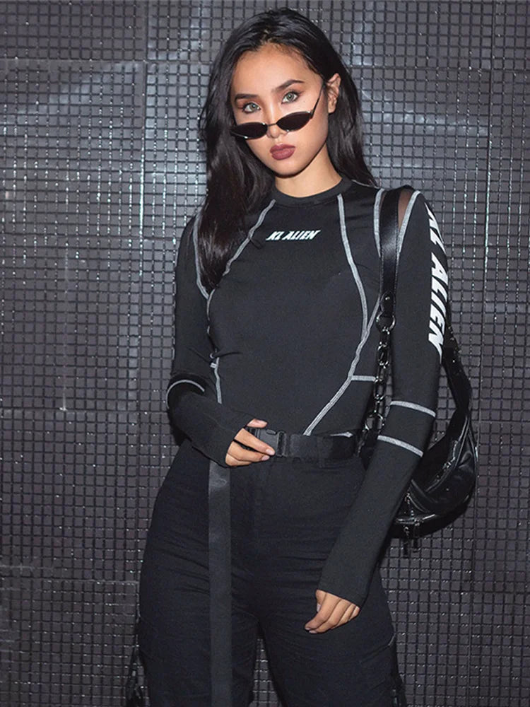 Black Rave Bodysuit featuring stylish long sleeves and sleek design, ideal for raves and techno parties.