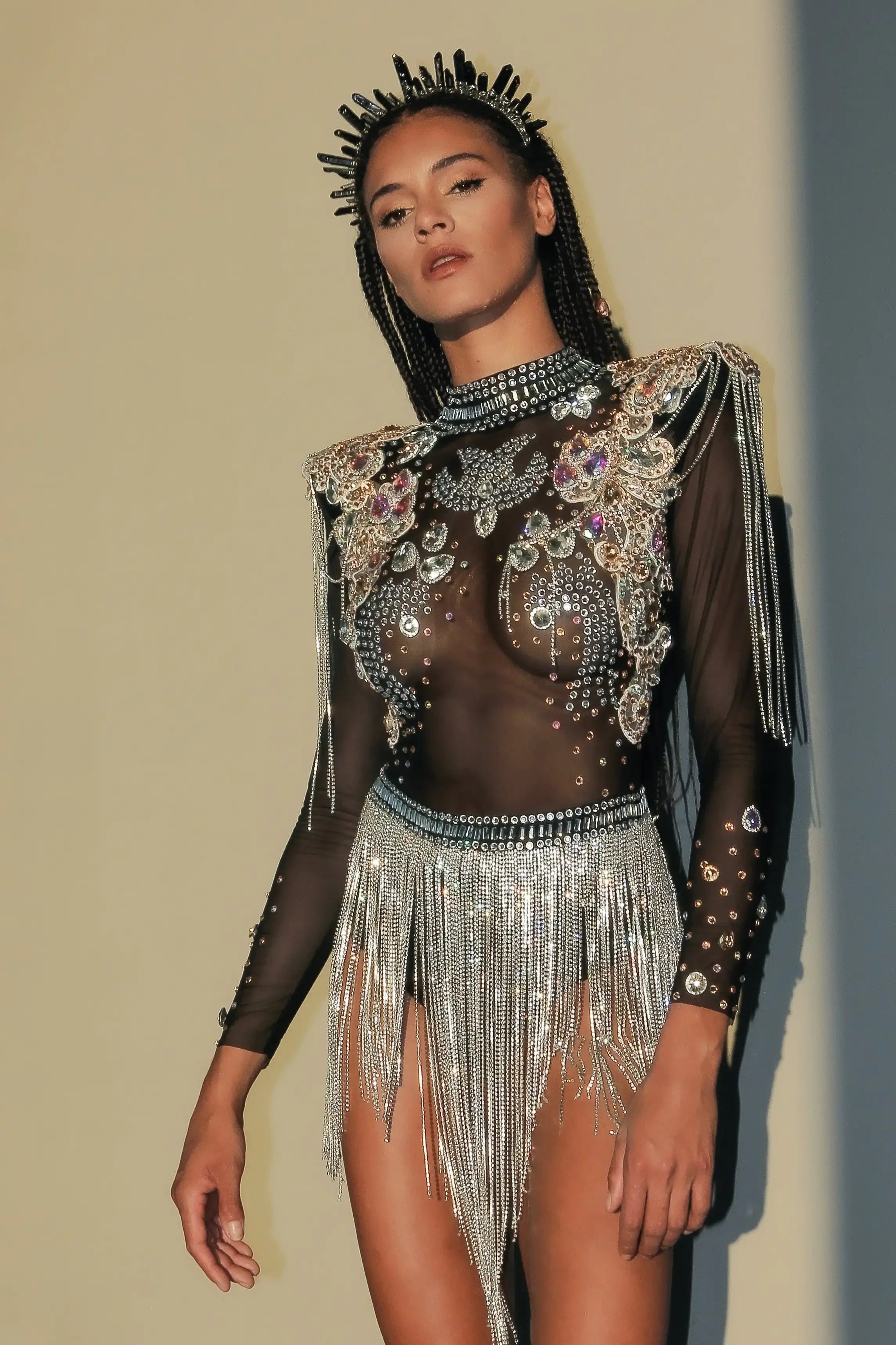 Rhinestone Tassel Festival Bodysuit with intricate rhinestone detailing and flowing tassels.