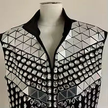 Silver mirror rhinestone men's vest with geometric panels and hand-glued rhinestones on a black polyester base.
