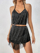 Schwarzes Tassel-Top und Set mit hoch taillierten Shorts mit stylischem Fransen-Design für Festival-Outfits.