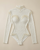 White pearl-embellished long sleeve bodysuit with a high neck and figure-hugging stretch fit.