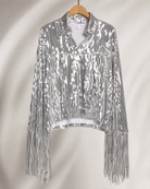 Silver sequin jacket with long fringe sleeves, displayed on a wooden hanger.