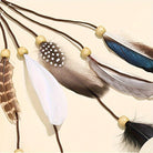 Faux Feather Headband with elegant tassels and colorful feathers on brown strings for bohemian style.