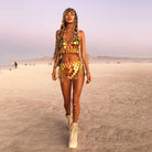 Festival Top and Tassel Mini Skirt Set worn by a model at a festival, featuring colorful designs and tassels.