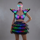 Futuristic black LED tutu bra set with glowing shoulder pieces and matching light-up glasses for festival performances.