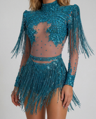 Teal rhinestone and sequin fringe bodysuit with sheer details, long sleeves, and high neck.
