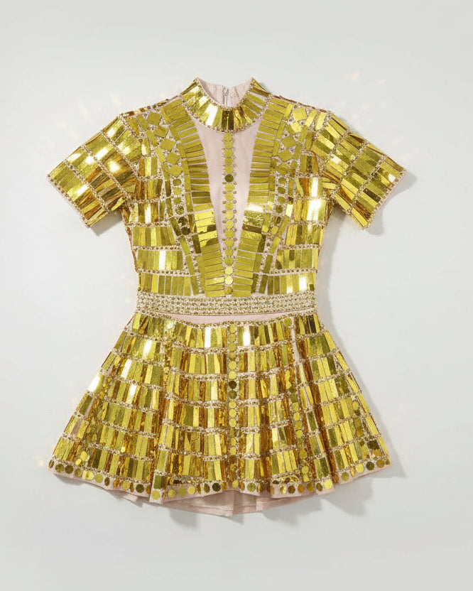 Gold reflective mirror sequin dress with short sleeves, high neck, and a body-contouring fit.