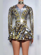 Gold and silver sequin mini dress with long sleeves, a V-neck, and a ruffled skirt.