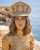 Soleil Gold Capitan Military Hat: sequined, rhinestone-encrusted hat with floral clusters, worn by a model.