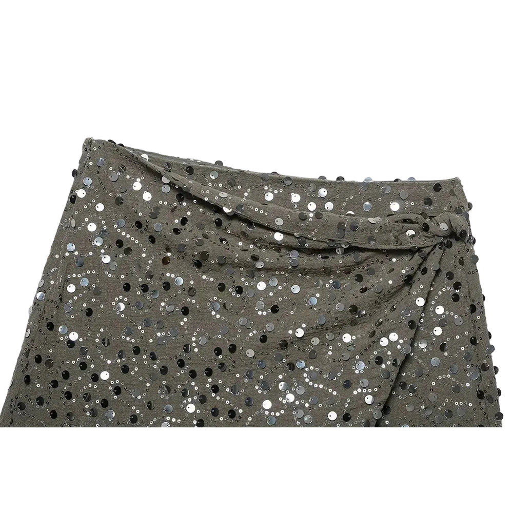 Green sequin crossover mini skirt with a stretch spandex base and all-over shimmer.