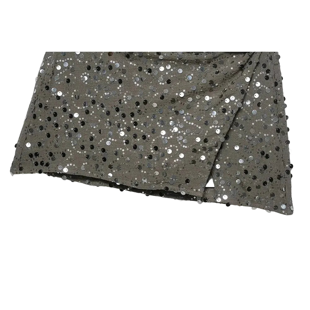 Green sequin crossover mini skirt with a stretch spandex base and all-over shimmer.