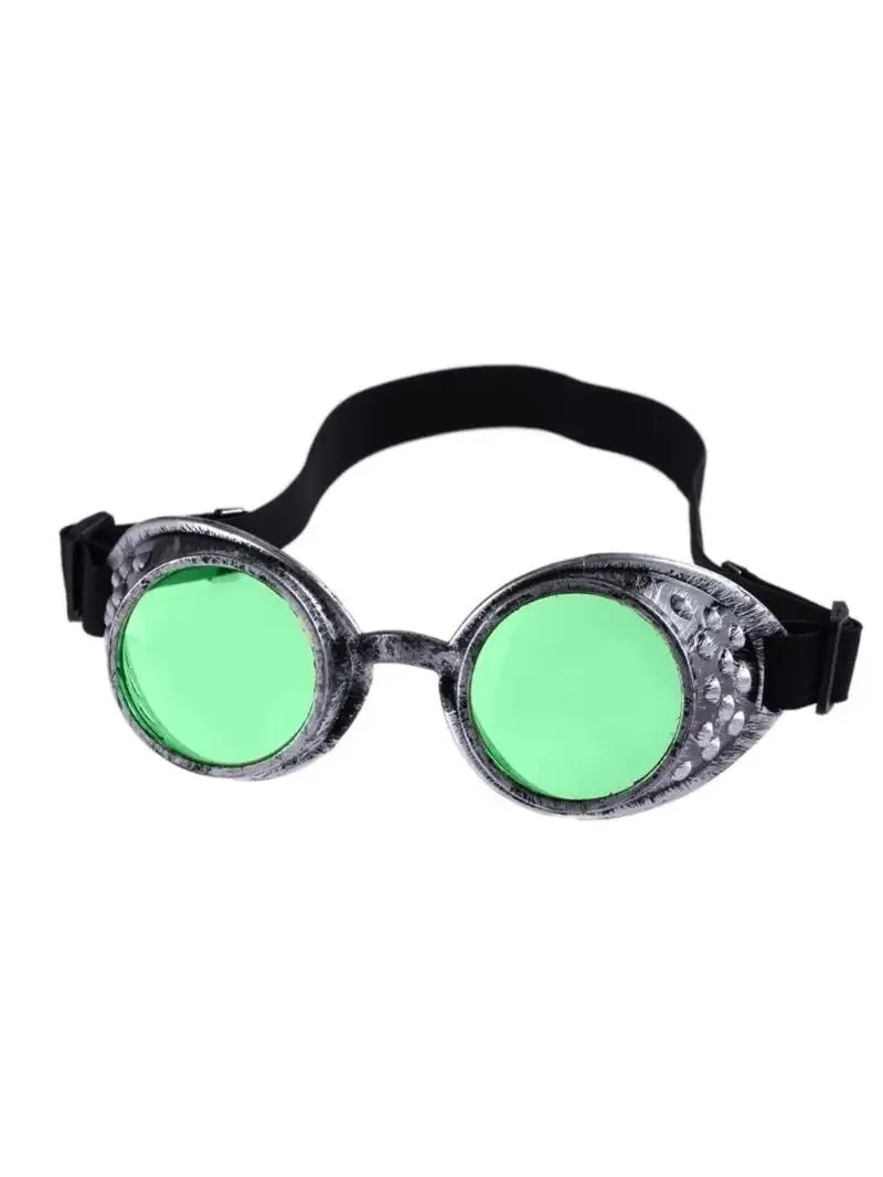 Vintage steampunk goggles with distressed silver metallic frames, bright green lenses, and a black adjustable elastic strap.