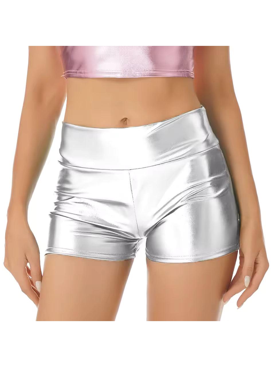 Silver holographic low-rise hot shorts with a wide elastic waistband, paired with a pink metallic crop top.
