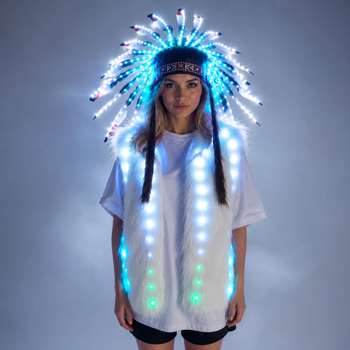Model wearing a white faux fur vest and matching feathered headdress with glowing blue LED lights.