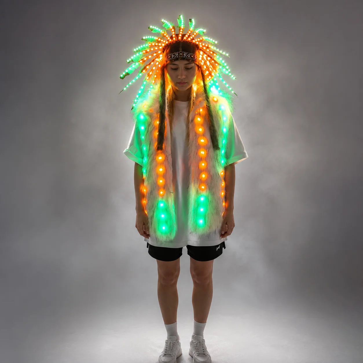 Model wearing a plush faux fur vest and feathered headdress set with remote-controlled, multi-colored LED lighting.