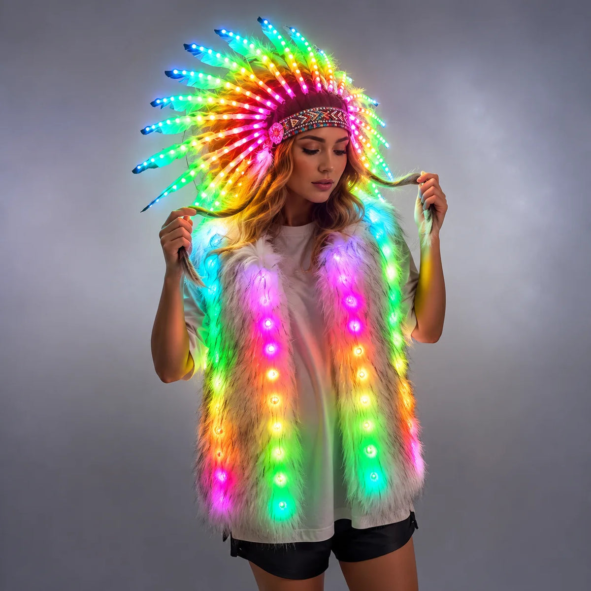 Model wearing a plush white faux fur vest and matching feathered headdress illuminated by vibrant, remote-controlled LEDs.