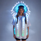 Model wearing a glowing LED feathered headdress and matching white faux fur vest with vibrant blue light effects.