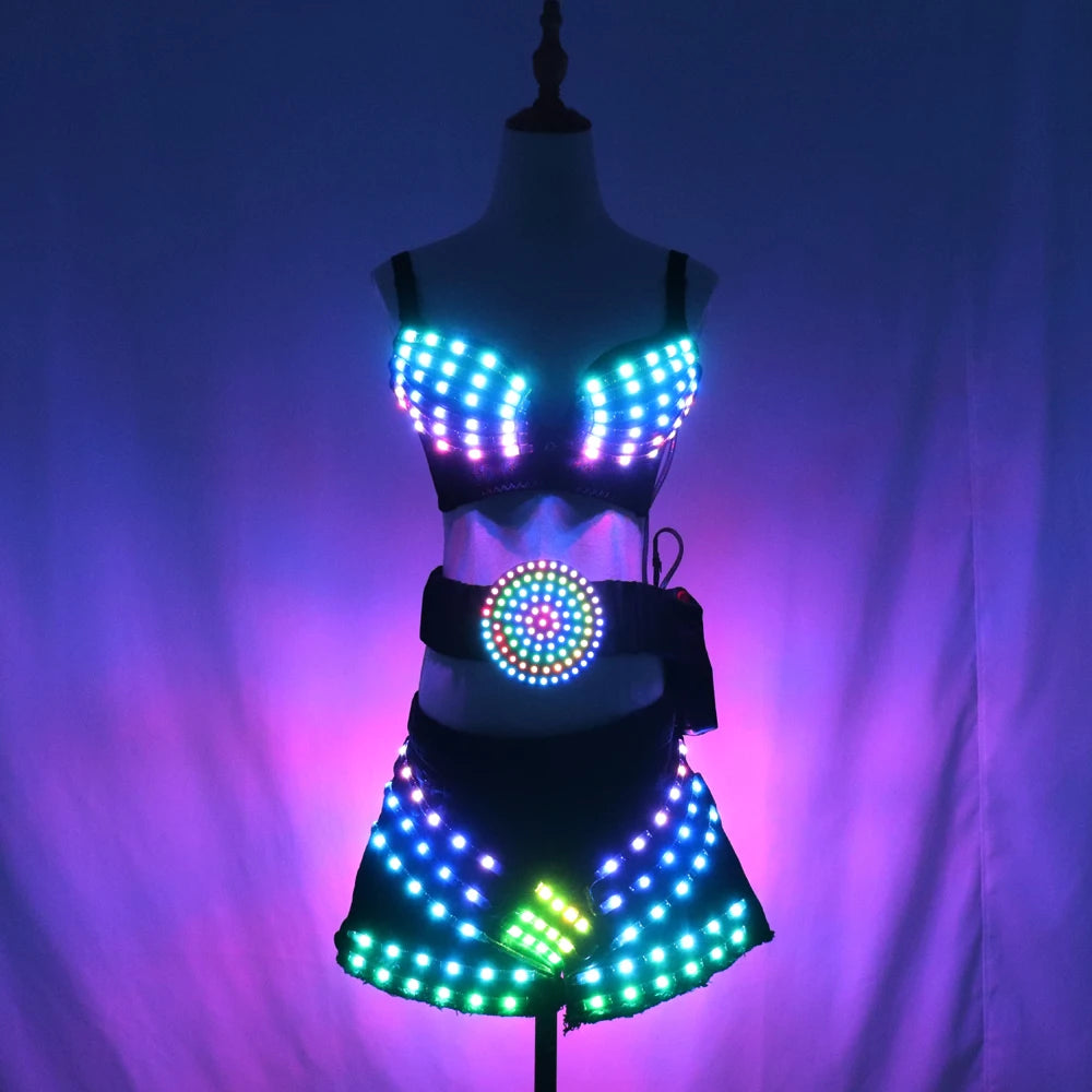 Three-piece LED light-up rave set featuring a glowing bra, belt, and shorts in black stretch fabric with remote control.