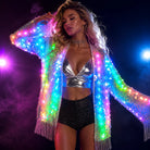 Woman wearing a glowing LED sequin fringe jacket with remote-controlled multicolored lights and metallic silver accents.