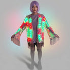 Model wearing a sequin fringe jacket with integrated LED lights in a vibrant, multi-colored display.