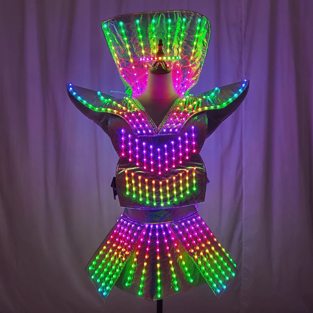 Futuristic LED shoulder armor dress with a metallic finish, featuring remote-controlled multicolored lights and a mini skirt.