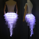 White layered tulle tutu skirt with integrated glowing LED lights on a mannequin, shown from back and side angles.