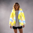 Model wearing a white faux fur hooded jacket featuring integrated, glowing yellow and blue LED lights.