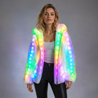 Woman wearing a plush white faux fur hooded jacket featuring vibrant, multi-colored LED lights along the front and hood.