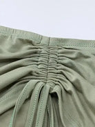 Grünes Crop-Top mit langen Ärmeln und Minirock