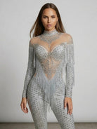 Luna Rhinestone Fringe Jumpsuit: full-length, silver, with sheer high-neck and dramatic fringe cape.