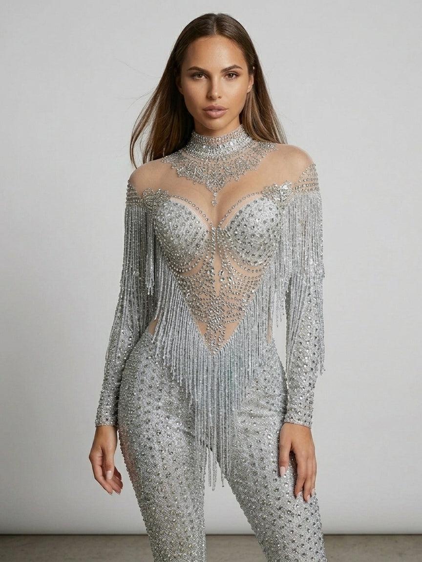 Luna Rhinestone Fringe Jumpsuit: full-length, silver, with sheer high-neck and dramatic fringe cape.