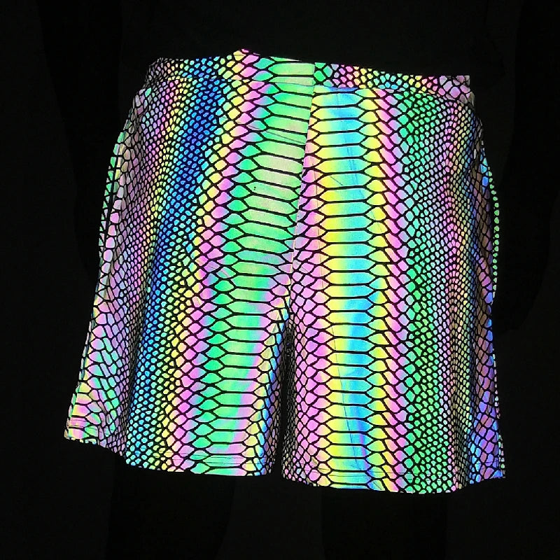 Men's reflective festival shorts with a vibrant, iridescent snakeskin pattern on a dark background.
