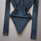 Mesh Patchwork Bodysuit in lightweight blue mesh with long sleeves, perfect for festival dancing.