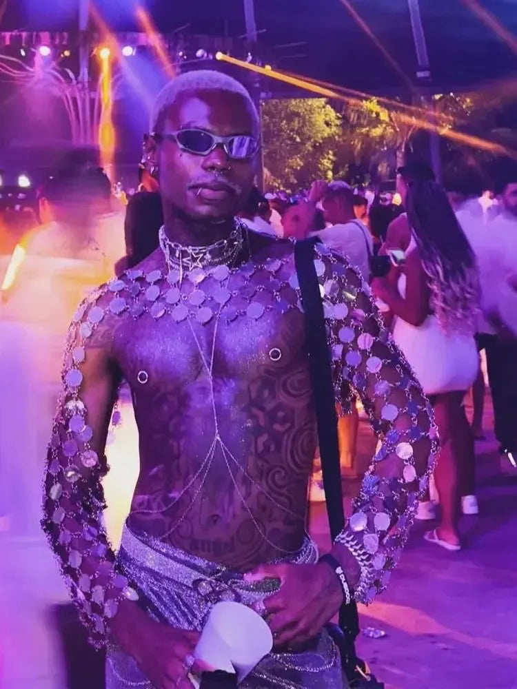 metal chain disc crop top worn at a vibrant party, showcasing metallic circular discs and edgy style