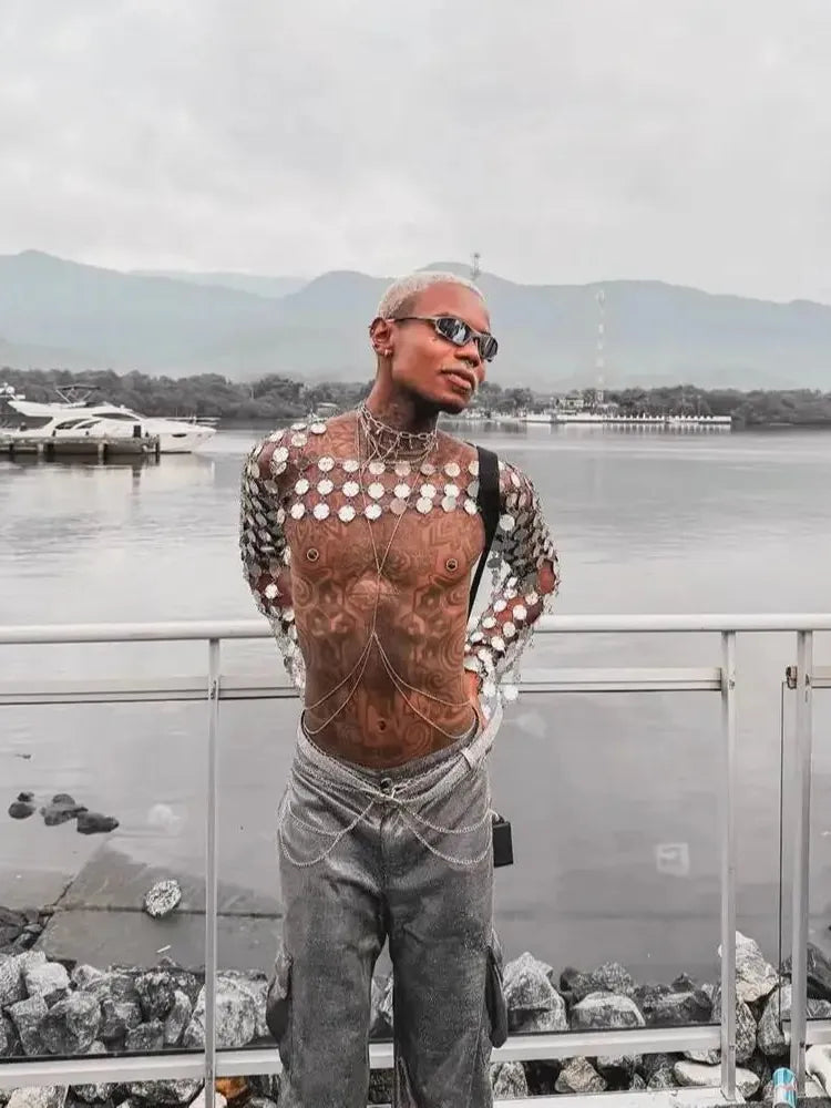 metal chain disc crop top side-profile view with metallic discs by water, edgy fashion statement