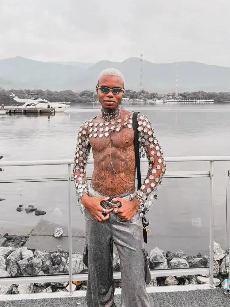 metal chain disc crop top close-up model posing by water with mountains in background