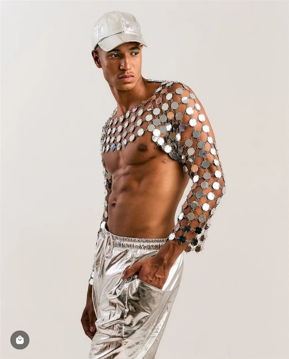 metal chain disc crop top close-up metallic reflective circular discs on stylish model