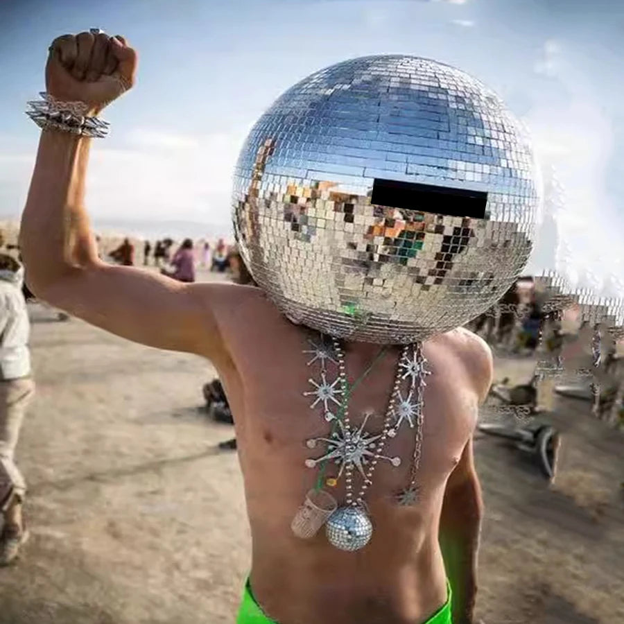 40cm Mirror Disco Ball Helmet made of ABS with hundreds of mirror panels, worn by a person outdoors.