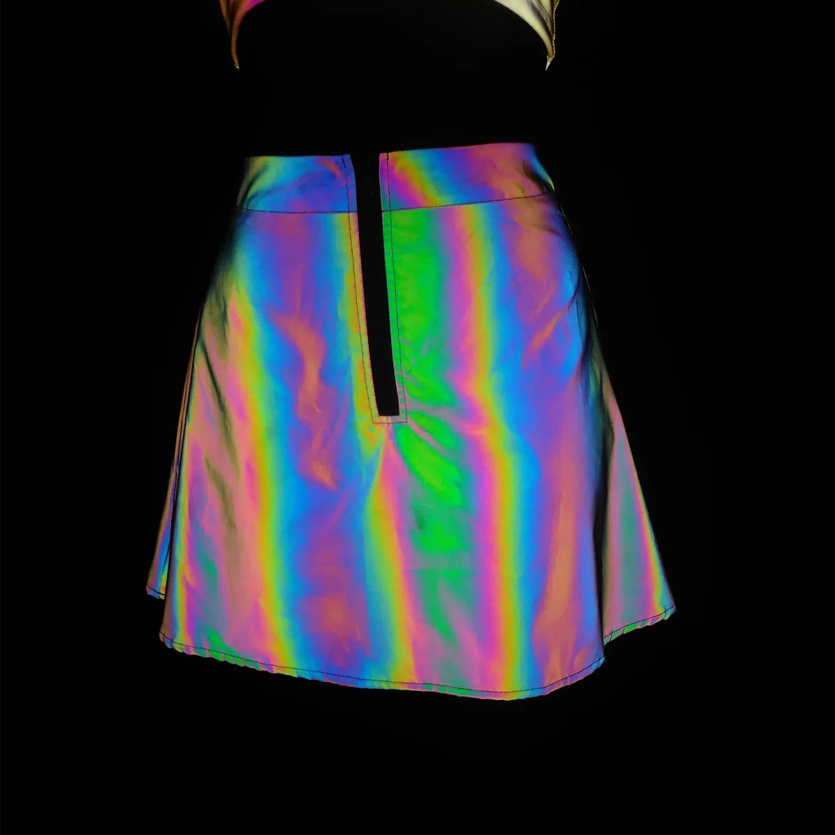 Multicolor reflective polyester mini skirt with a front zipper, part of a two-piece set.