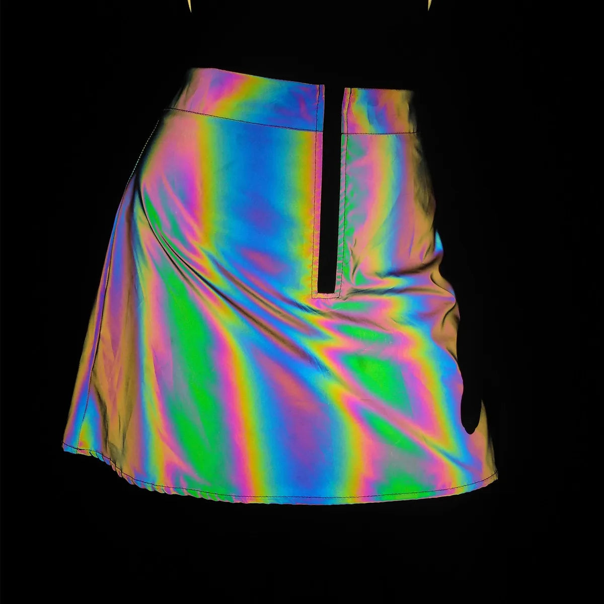 Multicolor reflective mini skirt with a front zipper, showcasing its iridescent rainbow effect.